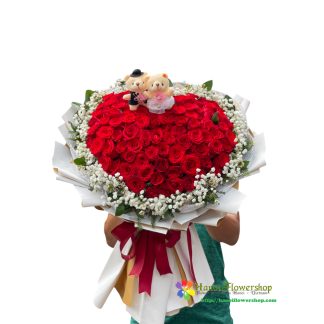 Order heart shaped red roses with mini teddy bear in Hanoi