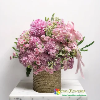 Pink hydrangea flower basket with delicate pink roses in Hanoi