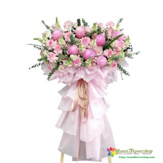 Pink opening ceremony flower stand in Hanoi