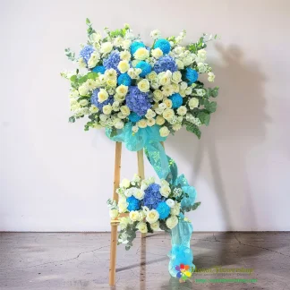 Blue and white opening flower stand in Hanoi with roses and hydrangeas
