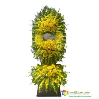 Yellow condolence flower stand delivery Hanoi