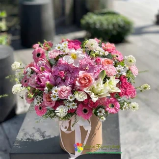 Pink birthday flower arrangement with roses and mixed flowers in Hanoi
